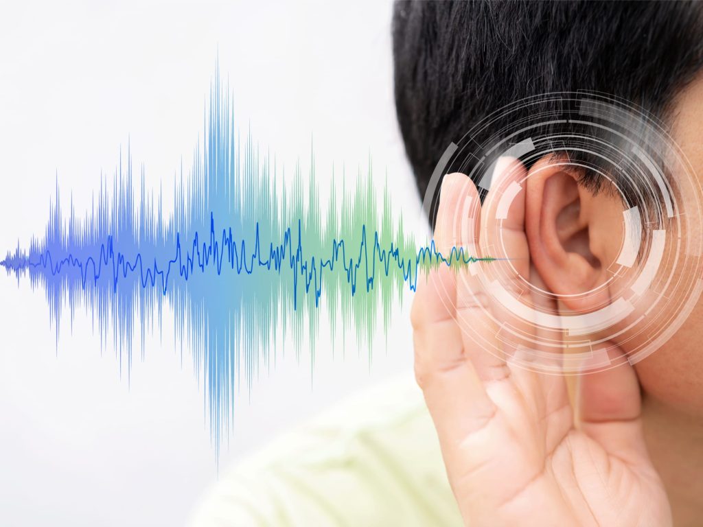 a person listening to a sound wave