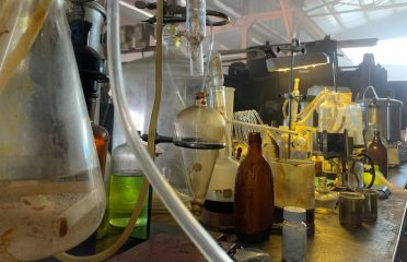 a group of glass bottles and other objects on a table